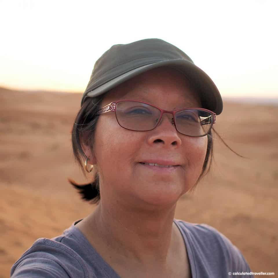 Calculated Traveller Mary wearing her Sunday Afternoons Sun Tripper Cap in the Moroccan desert 