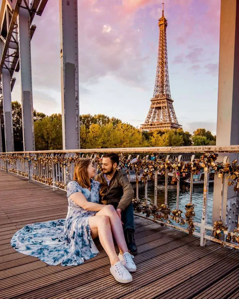 Smartphone travel photograph of a couple on a walkway with Eiffel tower in the background