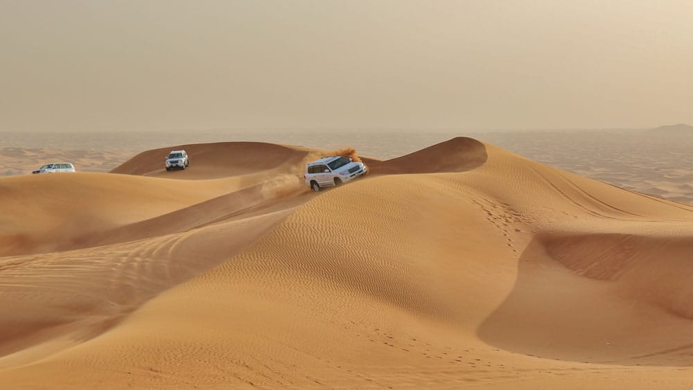 Cars driving in the Dubai desert