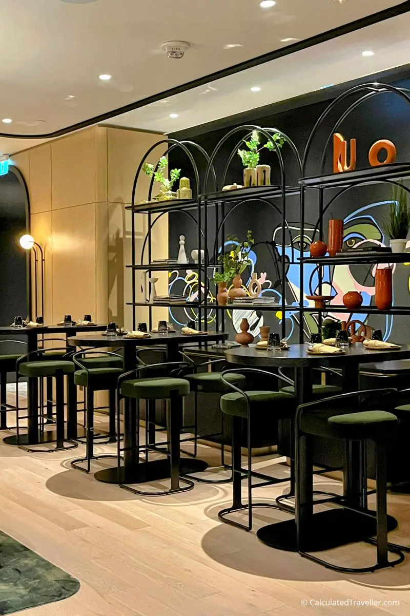 High-top tables and stools inside Dia Restaurant